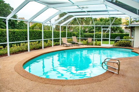 Private Pool with Tall Hedges