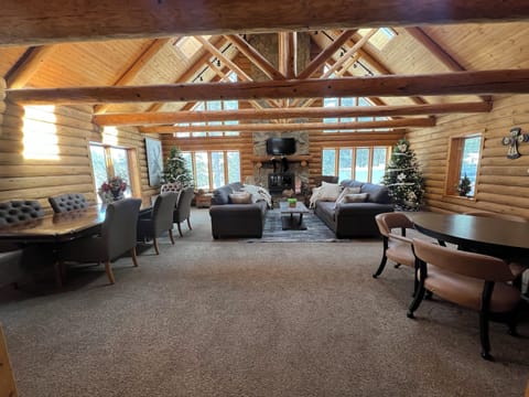Living room, open to kitchen and sunroom. 