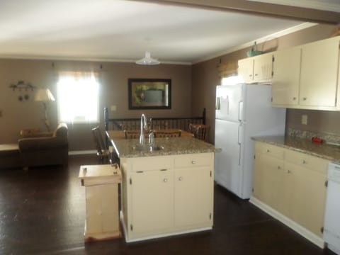 View of kitchen with living room to left