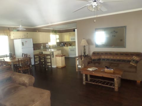 Living room with rustic furniture.   Hardwoods throughout.