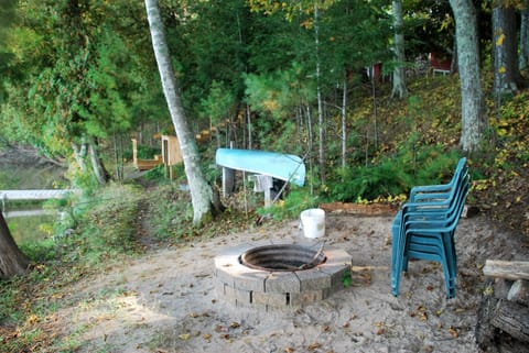 Fire Pit, Canoe, Life-Jacket Storage locker, next to the stairs.