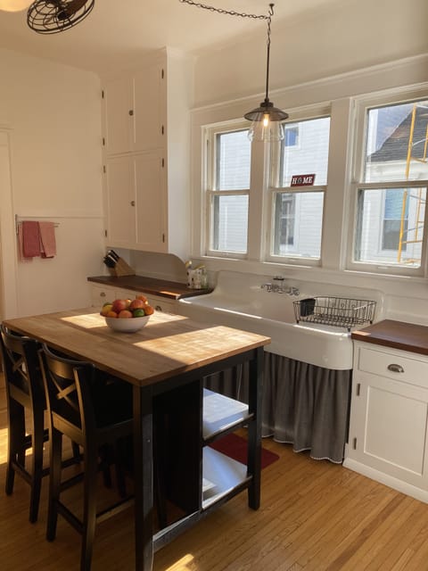 First floor kitchen with island and extra seating.