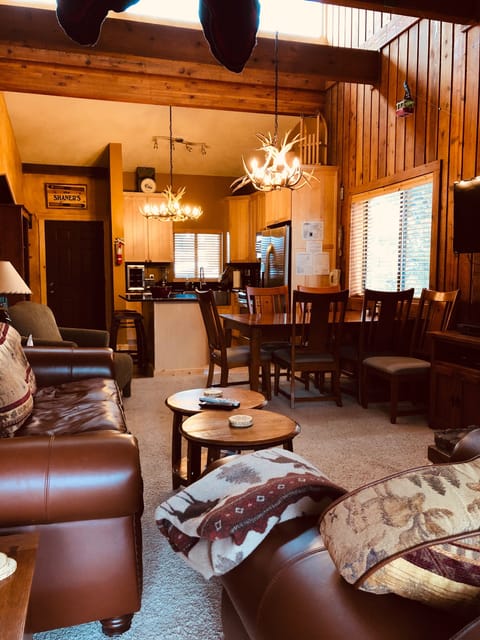 Living room with the kitchen in the background. 