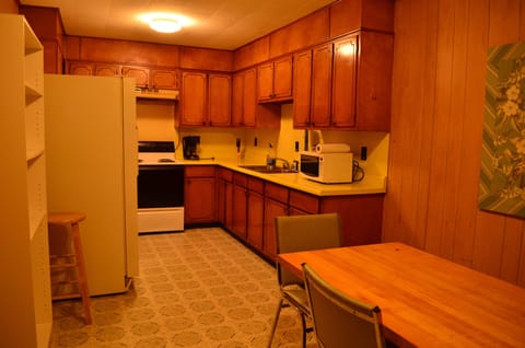 The large kitchen has mid-century feel - except for microwave and coffee maker!