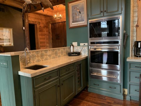 Kitchen with Wolf appliances, beverage fridge, bar sink