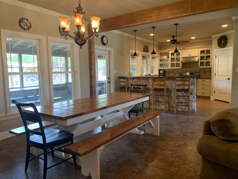 Farmhouse dining table seats 8-10, bar w/ 4 stools, seats large groups.