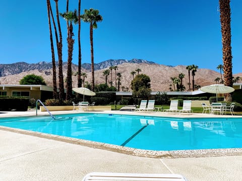 Large heated pool with pool furniture and beautiful views. 