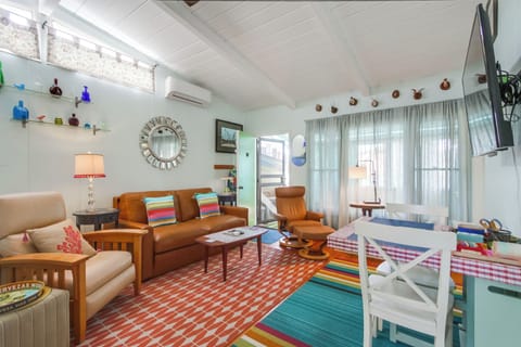 Living room with door to private covered paito