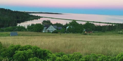Cottage sits above Hirtle's Beach and Romkey Pond. Walk to beach via path.