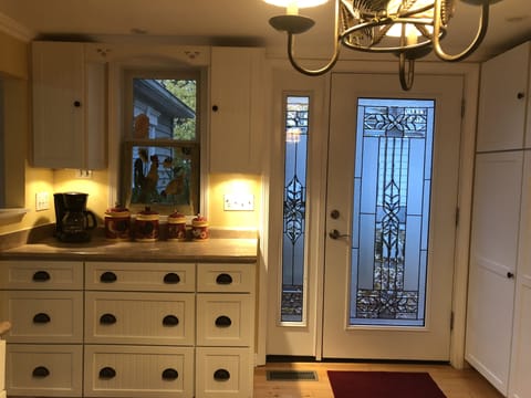 Kitchen door opens to back deck w/large grill and Blackstone to make meals easy!
