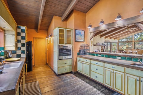 Kitchen is open to the living room bar counter.