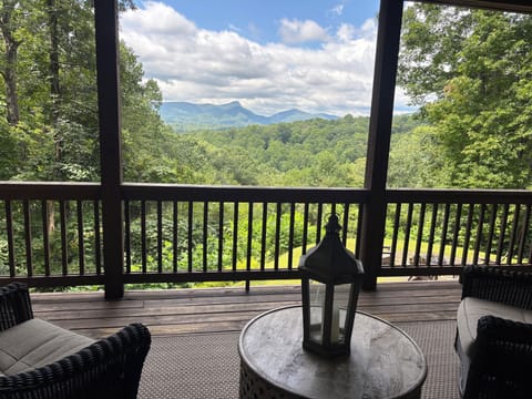 Spectacular view of Chimney Top Mountain from rear covered porch.