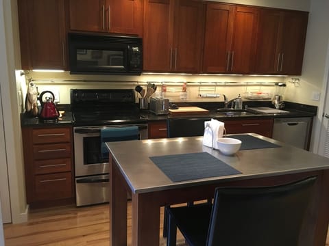 Updated Kitchen With Stainless Appliances and Granite Counters
