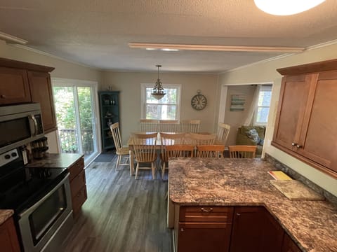 New Kitchen table and bar stools to accommodate up to 12 guests.