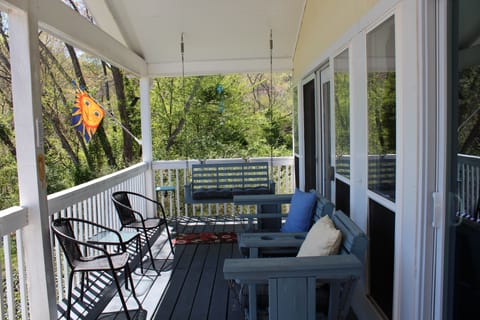 Relax on the porch as you look at the lake.