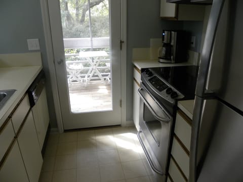 Kitchen with door to screened porch.