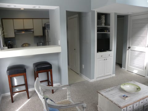 Kitchen, entertainment area, foyer on the right, with bath.