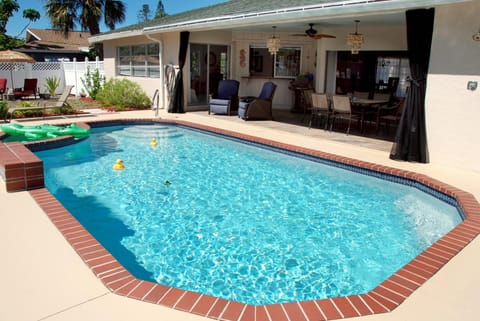 Heated south-facing pool right next to the Lanai and Kitchen