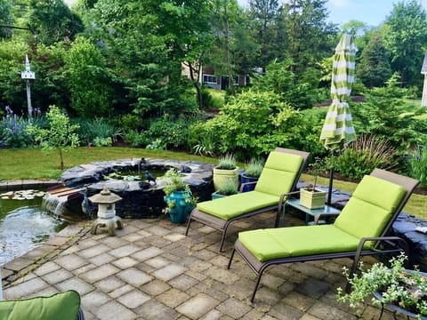 Lounge on the terrace beside the koi pond (netted for child safety).