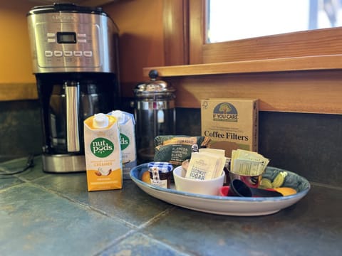 Fresh coffee, vegan milk, sweeteners in Kitchen