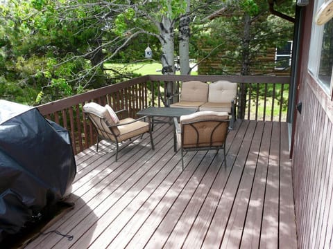 The back deck offers a place for enjoying conversations and the mountain air!