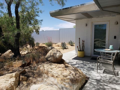 Front door of the guest studio with seating