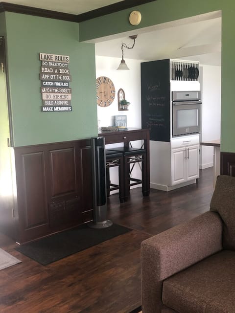 Family room leading into Kitchen. Small step down into kitchen.