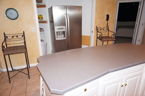 Newer stainless steel refrigerator in Huge Kitchen unbelievable counter space.