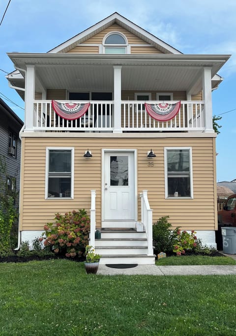 Front of House -view of deck. 2nd-3rd flr unit gets 2 off-street, driveway spots