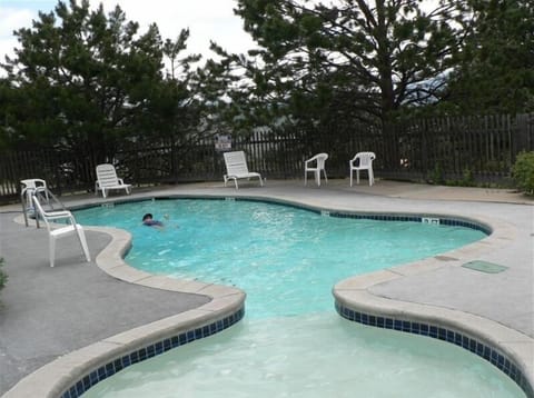 The swimming pool is only a few steps from Trail Ridge Cabin