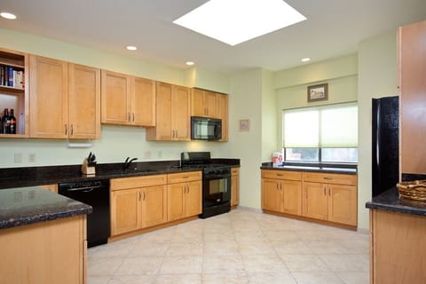 Roomy, updated kitchen with ample granite countertop space