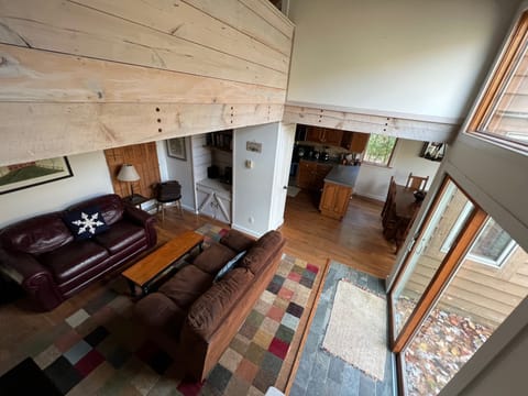 view of living room and dining room from the stairs