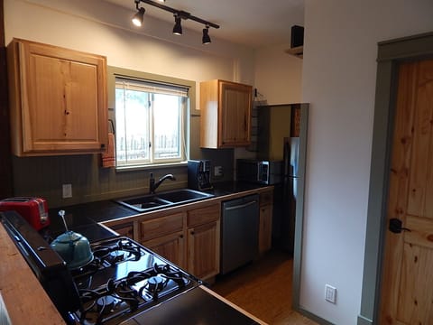 View of Kitchen.
Fully equipped with dishwasher, microwave, and coffee maker.