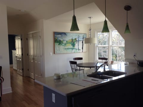 View from kitchen into dining area and hall to bedroom.  Lots of natural light.