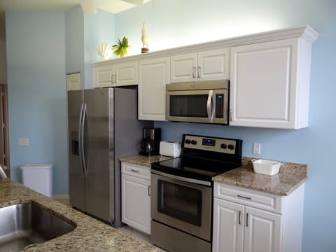 Kitchen with new appliances,  
coffee maker, toaster