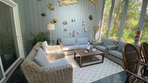 Enjoy your morning coffee on the large screened in porch