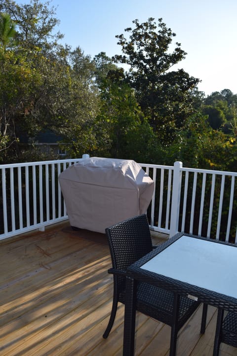 Back deck complete with propane grill and bistro table.