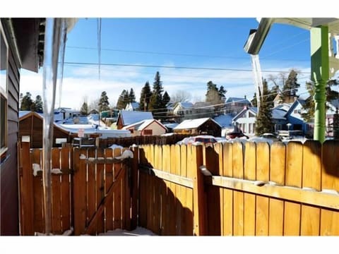 Back patio area where you can keep snowy skis and muddy bikes.