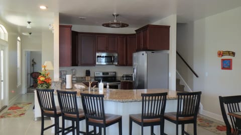 Brand new kitchen with granite counter tops, stainless steel appliances. 