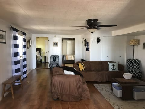 View of living room from kitchen. 1st and middle bedroom access.