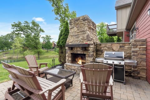 Patio with gas grill and wood burning fireplace