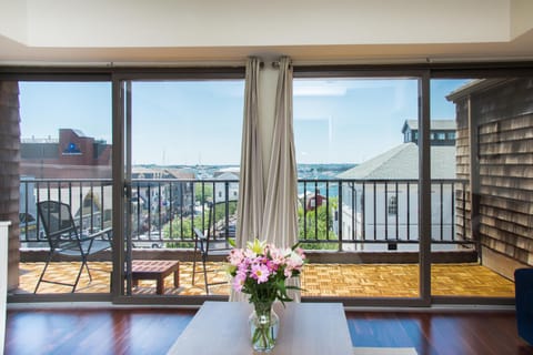 Enjoy a cocktail and the view from the private balcony.