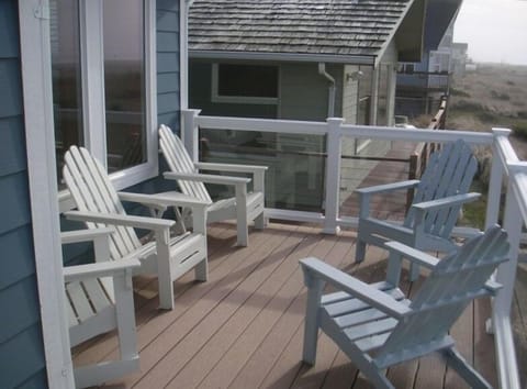 Sit outside on the deck and watch the ocean