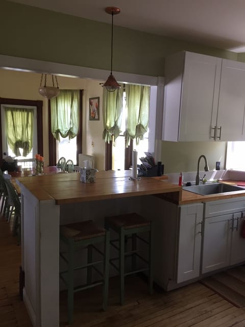 Kitchen with breakfast bar overlooking dining area