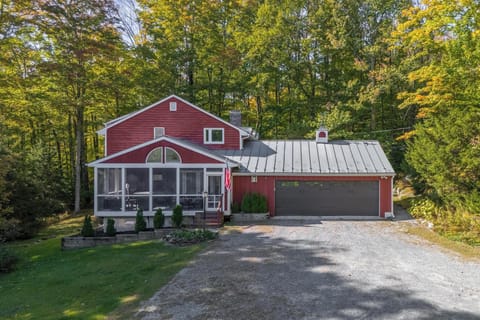Front of home with screened in porch.  Extra wide garage to fit extra large SUV.