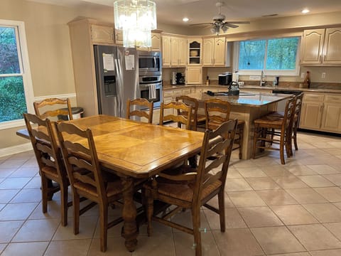 Island seating for 4 in kitchen along with 6 person dining room table.