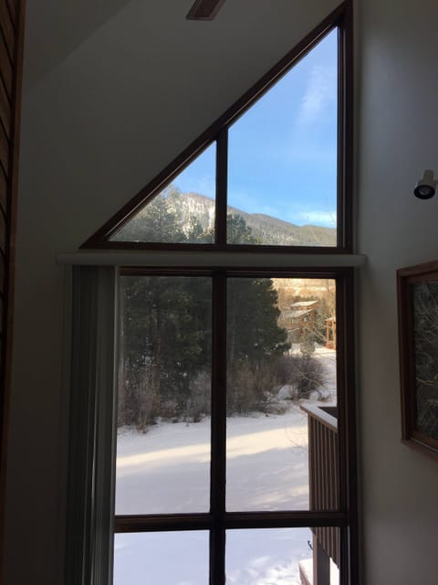 Three levels of windows with mountain view
