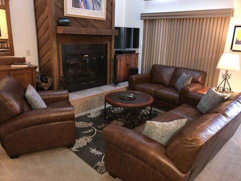 Living room with wood burning fireplace