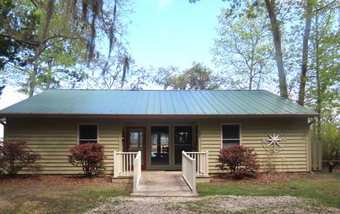 Modest on the front, but a million-dollar view from the marsh-side porch.