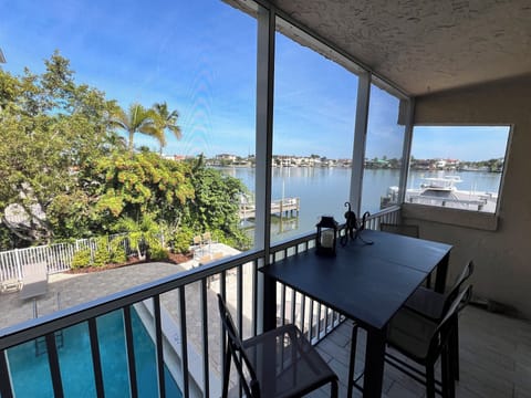 Enjoy the views from our end unit overlooking the pool and Vanderbilt Bay!